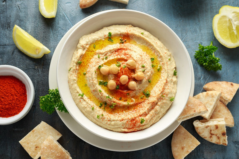 Hummus with olive oil, paprika, lemon and pita bread